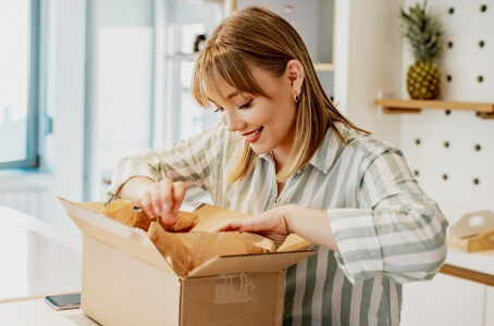 A woman unwrapping her package.