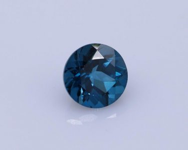 London Blue Topaz Faceted Gemstone in Round Shape