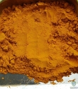 Turmeric powder , finger
